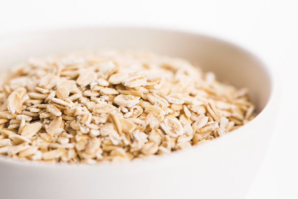 Oat flakes in bowl - Photo, Image