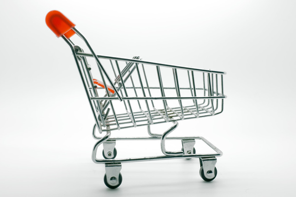 Empty shopping cart, side view, on white background - Foto, Imagen