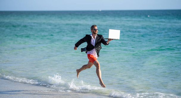 businessman is busy at retreat. summer vacation of manager business man. Businessman manager enjoying a beach break. Relaxing beach time for the manager businessman. business trip. - Photo, Image
