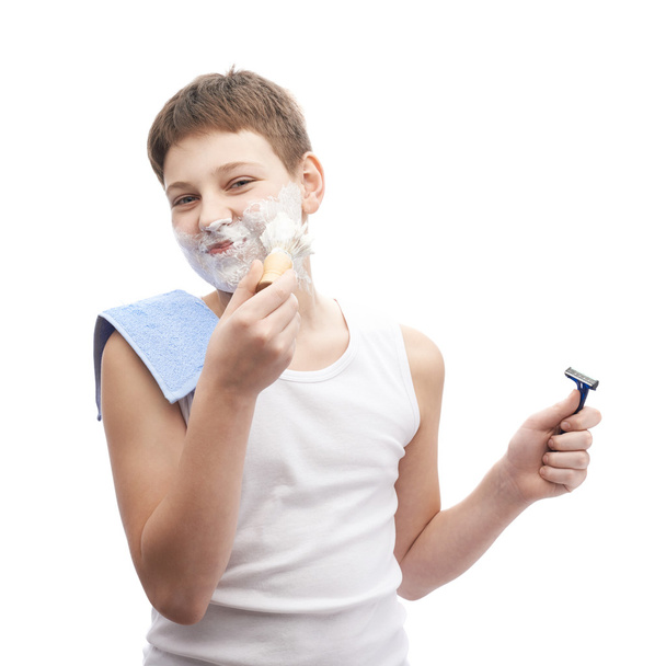 Young boy   in process of shaving - Фото, зображення