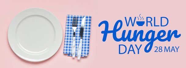 Banner para el Día Mundial del Hambre con plato, cuchillo y tenedor - Foto, imagen