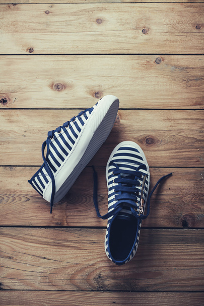 Stripe Sneakers wooden background - Photo, Image