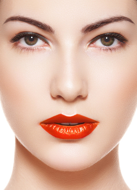 Cute model face with bright evening make-up, orange lipstick, purity skin - Foto, afbeelding