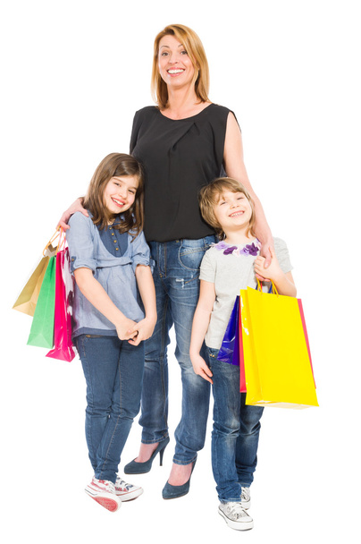 Happy shopping mother and daughters smiling - Foto, Imagem