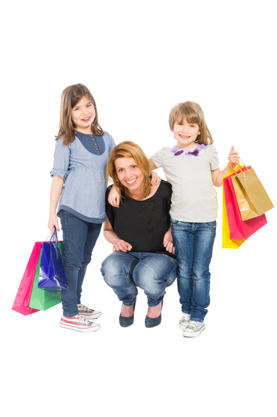 Gelukkig winkelen vrouw en haar twee dochters - Foto, afbeelding