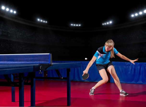 Girl table tennis player at sports hall - Фото, изображение
