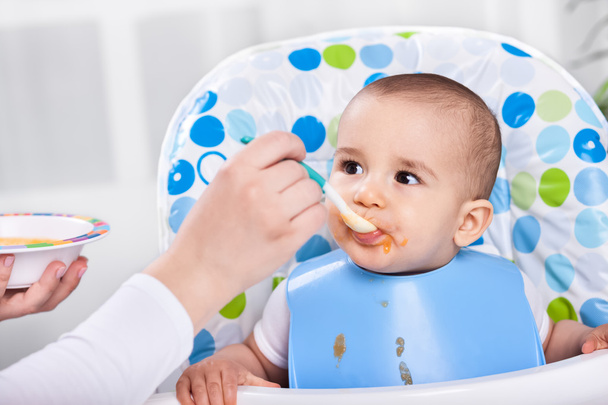 Adorable hugry baby child likes to eat - Photo, Image