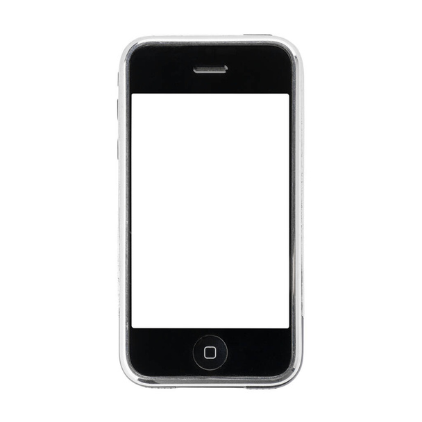 Dnepr, Ukrajna - 12.09.2023: Stúdiófelvétel egy régi Apple iPhone 1 fehér alapon. - Fotó, kép