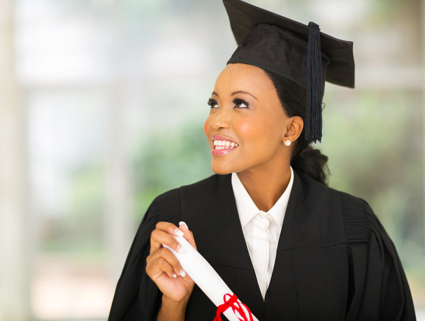 young african college graduate looking up - Zdjęcie, obraz