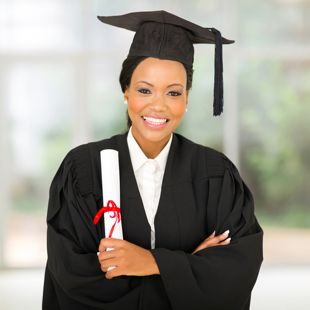 female african graduate with arms crossed - Фото, зображення