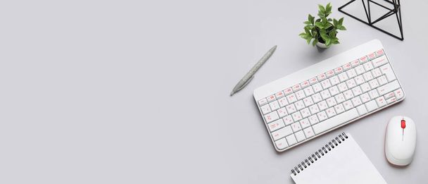 Wireless keyboard with computer mouse and office stationery on light background with space for text - Photo, Image