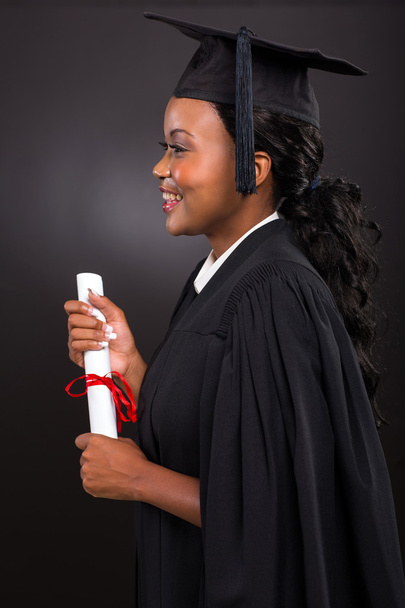 Side view of young female graduate - Фото, зображення