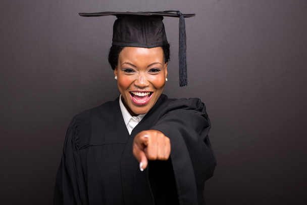 female college graduate pointing  - Foto, Imagem