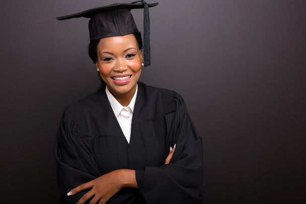 female college graduate with arms crossed - Фото, зображення