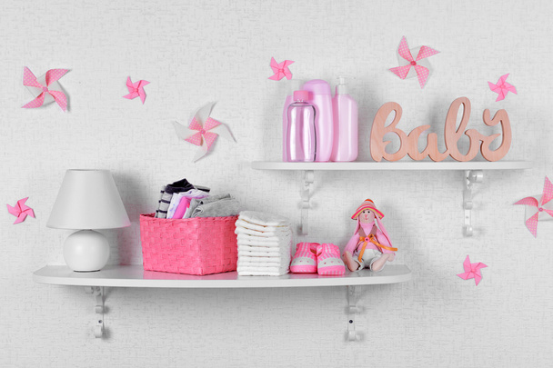 Baby accessories on shelves - Fotoğraf, Görsel