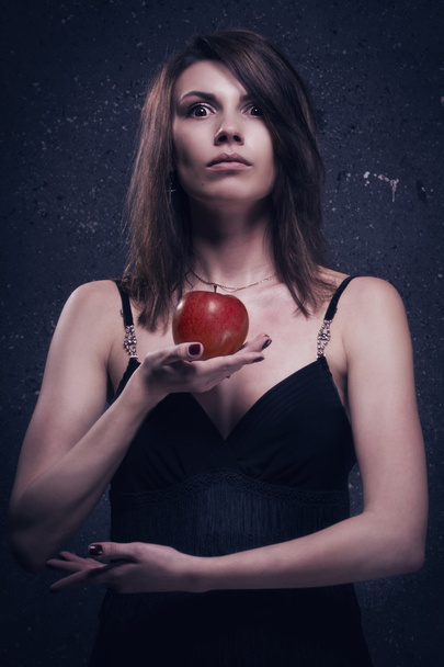 Lonely mad woman with red apple - Foto, immagini