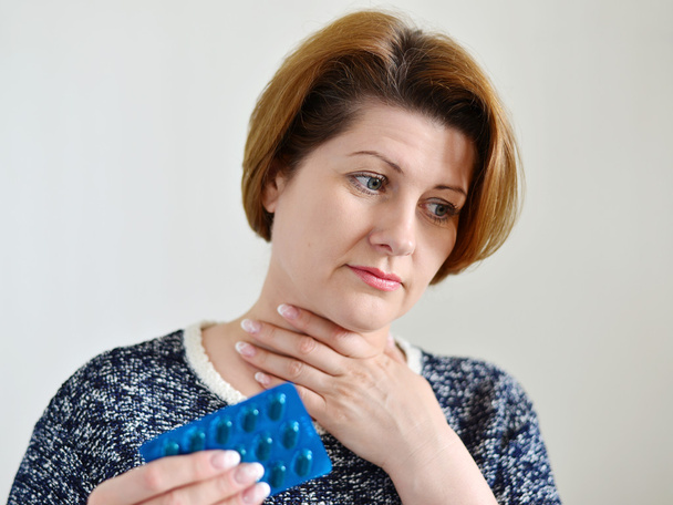 Adult woman with a sore throat  - Fotó, kép