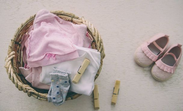 children's things in the basket. washing children's clothes - Photo, Image