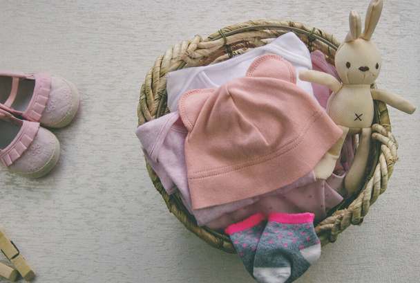 children's things in the basket. washing children's clothes - Photo, Image