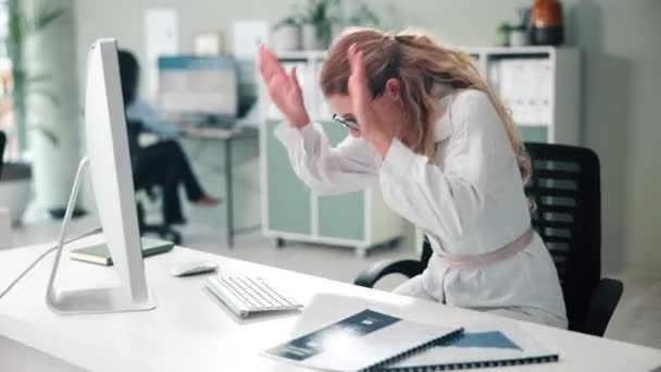 Baseball bat, smash and business woman with desktop in office for frustration, stress and mistake. Angry, fail and professional person hitting technology computer with sports equipment in workplace - Footage, Video