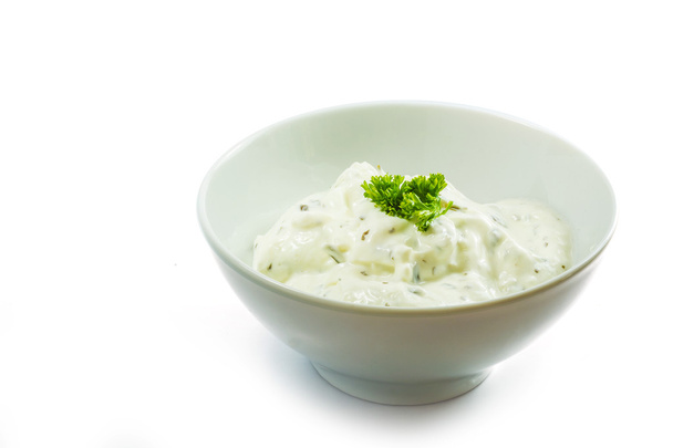 cream cheese dip with herbs in a ceramic bowl isolated on white  - Fotó, kép