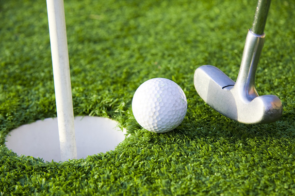 М'яч і гольф отвір
 - Фото, зображення