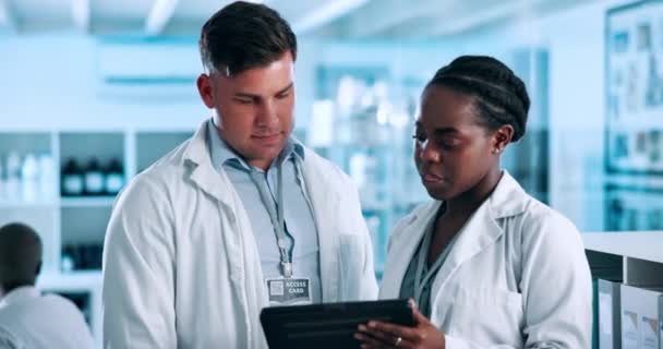 Scientist, teamwork and tablet in laboratory for medical research, data analysis and collaboration on vaccine. Diversity, science people or mentor with technology for planning, discussion or report. - Footage, Video