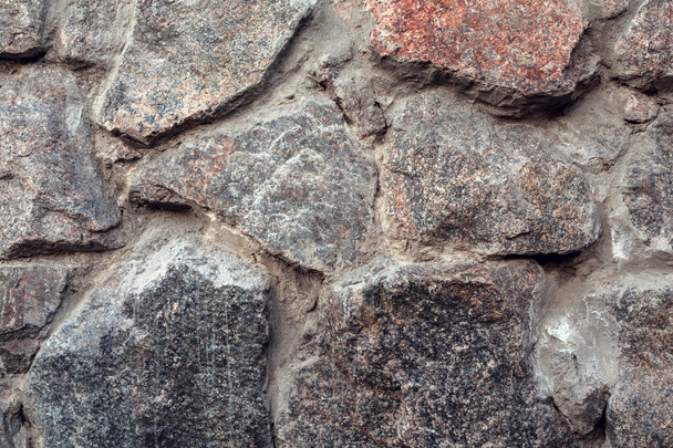 Mauer. natürliche Granit Stein Textur Hintergrund. rau und rostig - Foto, Bild
