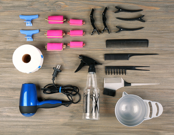 Hairdressing tools on wooden background - Фото, зображення