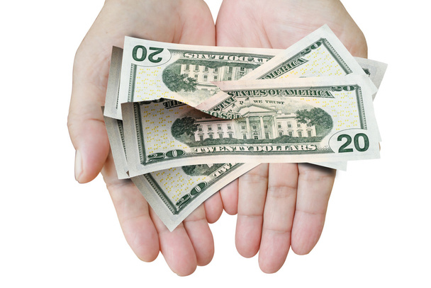 Muchos dólares cayendo en la mano de la mujer con dinero, papel roto
. - Foto, imagen