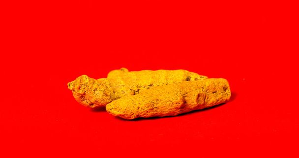 Barks of Turmeric on Red Background - Photo, Image