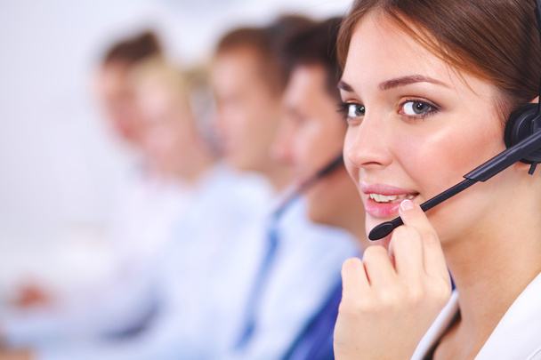 Attractive Smiling positive young businesspeople and colleagues in a call center office - Фото, зображення