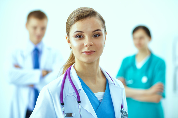 Woman doctor standing with stethoscope at hospital - Foto, imagen