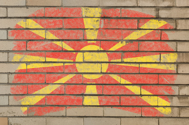 Flaga Macedonii na mur z cegły ilustracja malowane z kredy - Zdjęcie, obraz