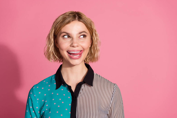 Photo portrait of pretty young girl lick teeth tasty look empty space wear trendy striped cyan outfit isolated on pink color background. - Φωτογραφία, εικόνα