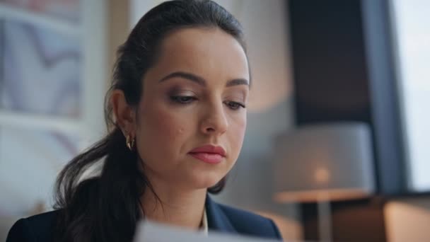 Closeup focused businesswoman reading documents at desk. Pensive executive planning future partnership thinking business in office. Brunette woman manager approve contract starting corporate project - Footage, Video