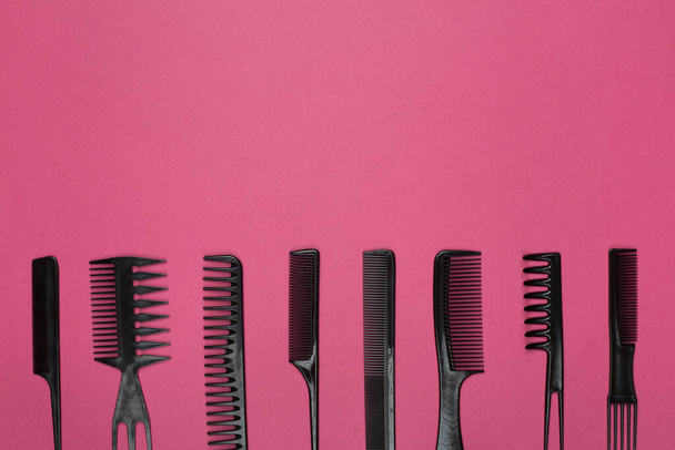 Professional combs and hairdresser tools on color background, top view - Photo, Image