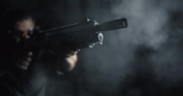 Slow-Motion High-Speed Shot of Man Aiming and Firing Shotgun, Close-Up of Powerful Blast with Smoke - Footage, Video
