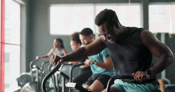 Bike, gym and people with fitness, training and challenge with endurance and cardio with wellness. Health, group and equipment with energy and cycling with increase heart rate or exercise machine. - Footage, Video