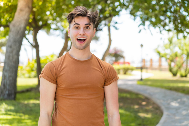 Young handsome man with surprise facial expression - Photo, Image