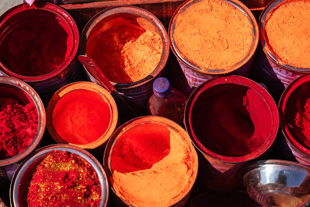 colorful vermilion kept for selling at holy place at street shop at morning - Photo, Image