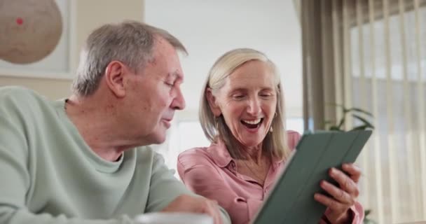 Mature, couple and relax with tablet in home with website for streaming movies or comedy video. Happy, man and woman with tech to scroll online with social media, chat about post and reading news. - Footage, Video