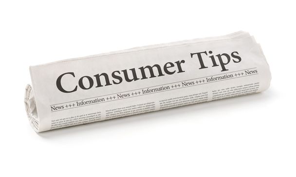 Periódico enrollado con el titular Consumer Tips
 - Foto, Imagen