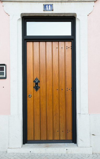 Entrance door and a number 11 on the light wall - Φωτογραφία, εικόνα
