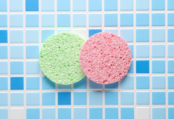 Make-up remover sponges on blue tiles. Beauty concept - Photo, Image