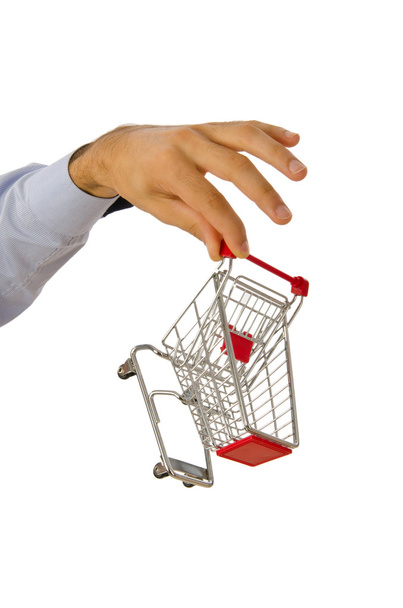 Hand holding shopping cart on white - Zdjęcie, obraz