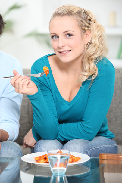 Woman eating a meal - Фото, изображение