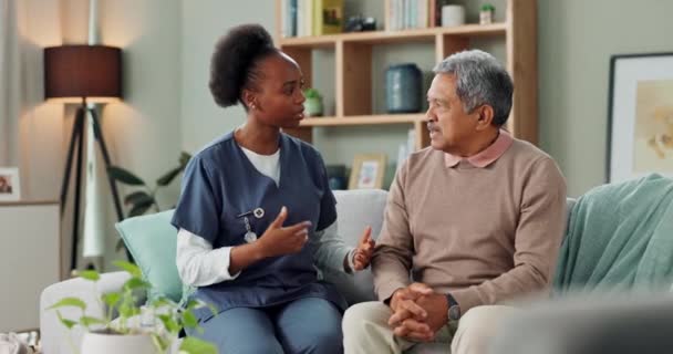 Senior, man and coughing with nurse for healthcare consultation with water, support and discussion. Elderly patient, caregiver and sick with lung cancer, breathing problem or homecare in nursing home. - Footage, Video