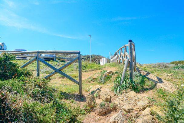 wooden fence by Capo Testa shore - Photo, Image