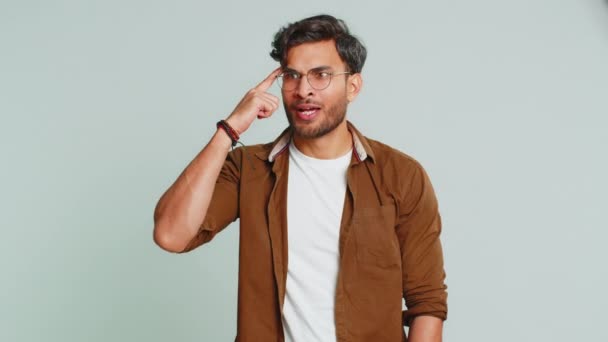 Eureka. Inspired Indian young man pointing finger up with open mouth, having good idea, plan, startup, showing inspiration motivation gesture, problem solution. Arabian guy isolated on gray background - Footage, Video